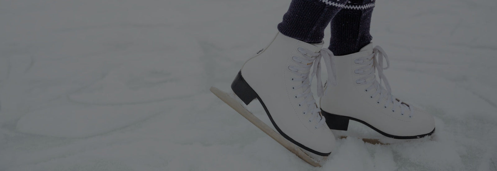 Pair of heated winter slippers displayed on a white background representing cozy footwear