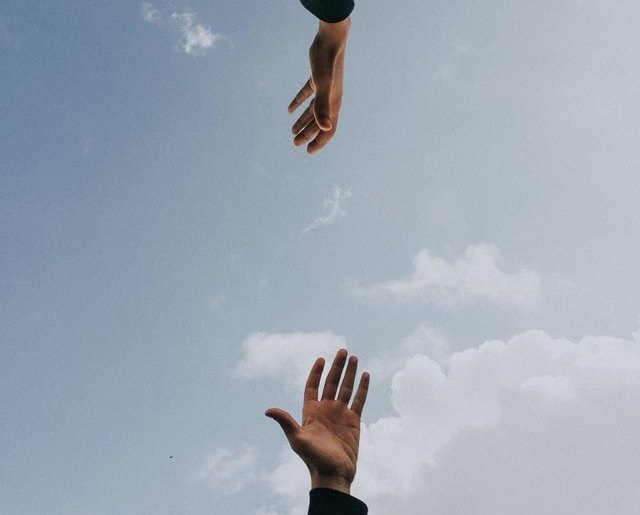 A hand reaching forward representing products proudly designed, developed, and shipped from the USA