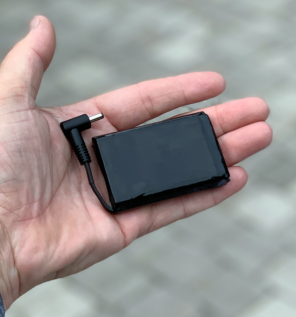 replacement rechargeable battery for lava electric heated boot shown in hand